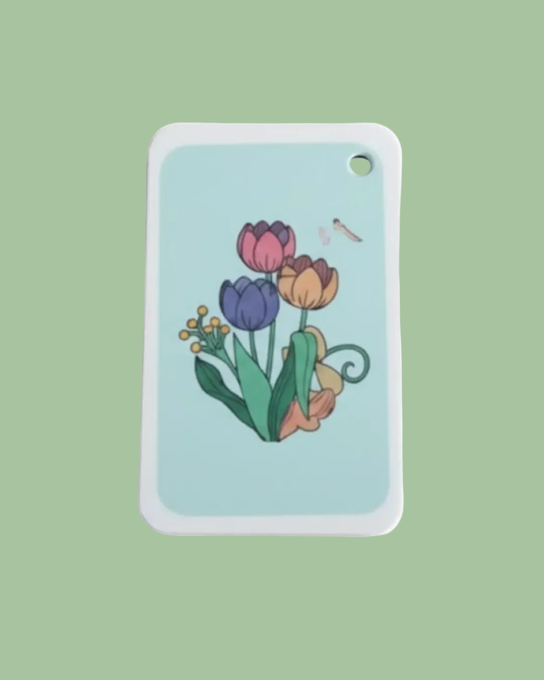Dish Sponge with colorful tulip design on a light blue background