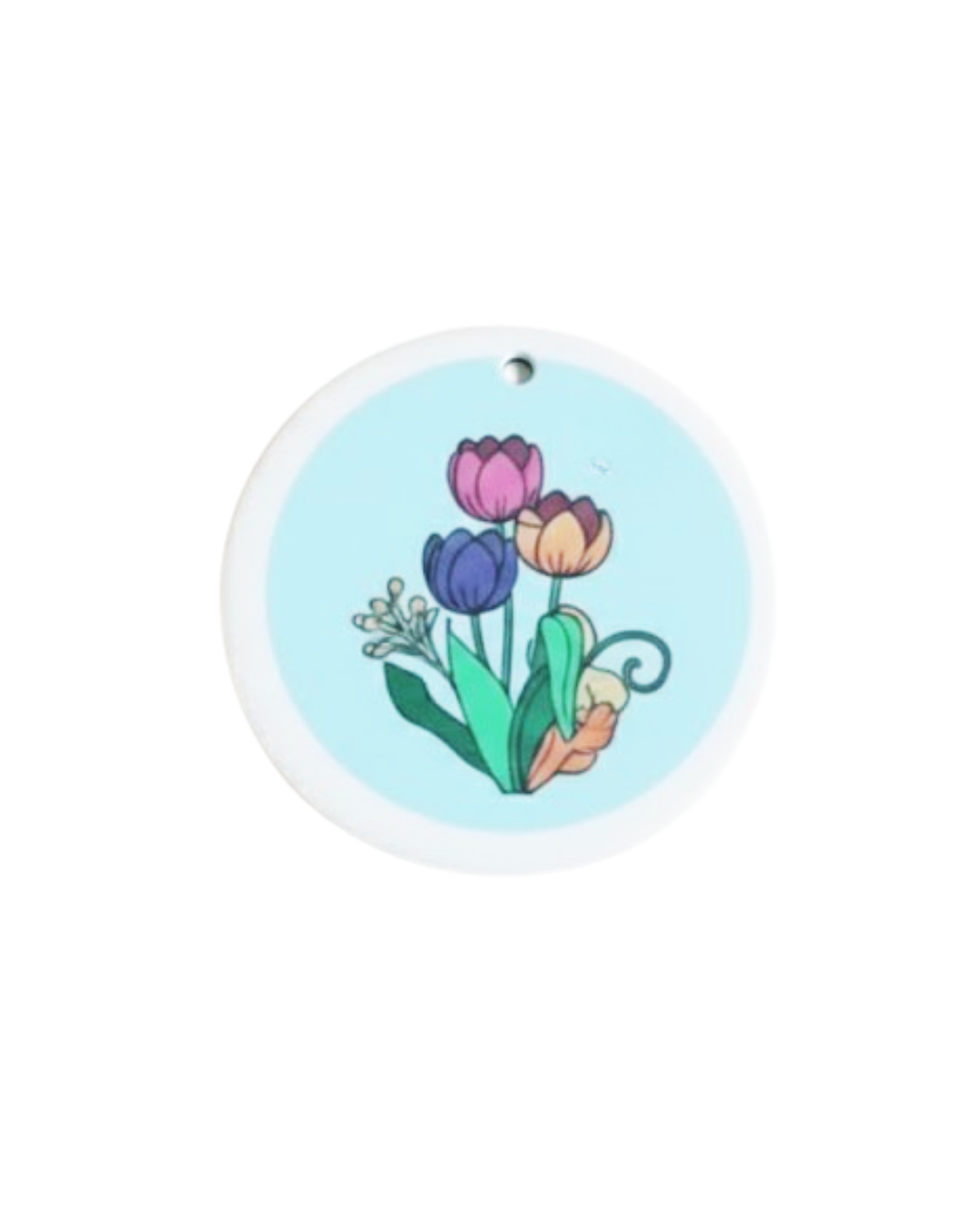Round Dish Sponge with colorful tulip design on a light blue background