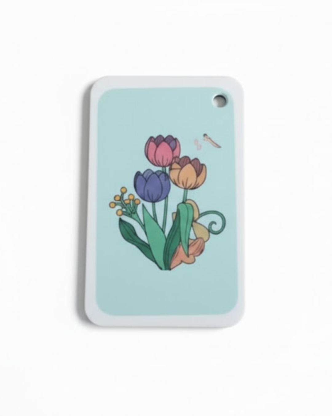 Dish Sponge with colorful tulip design on a light blue background