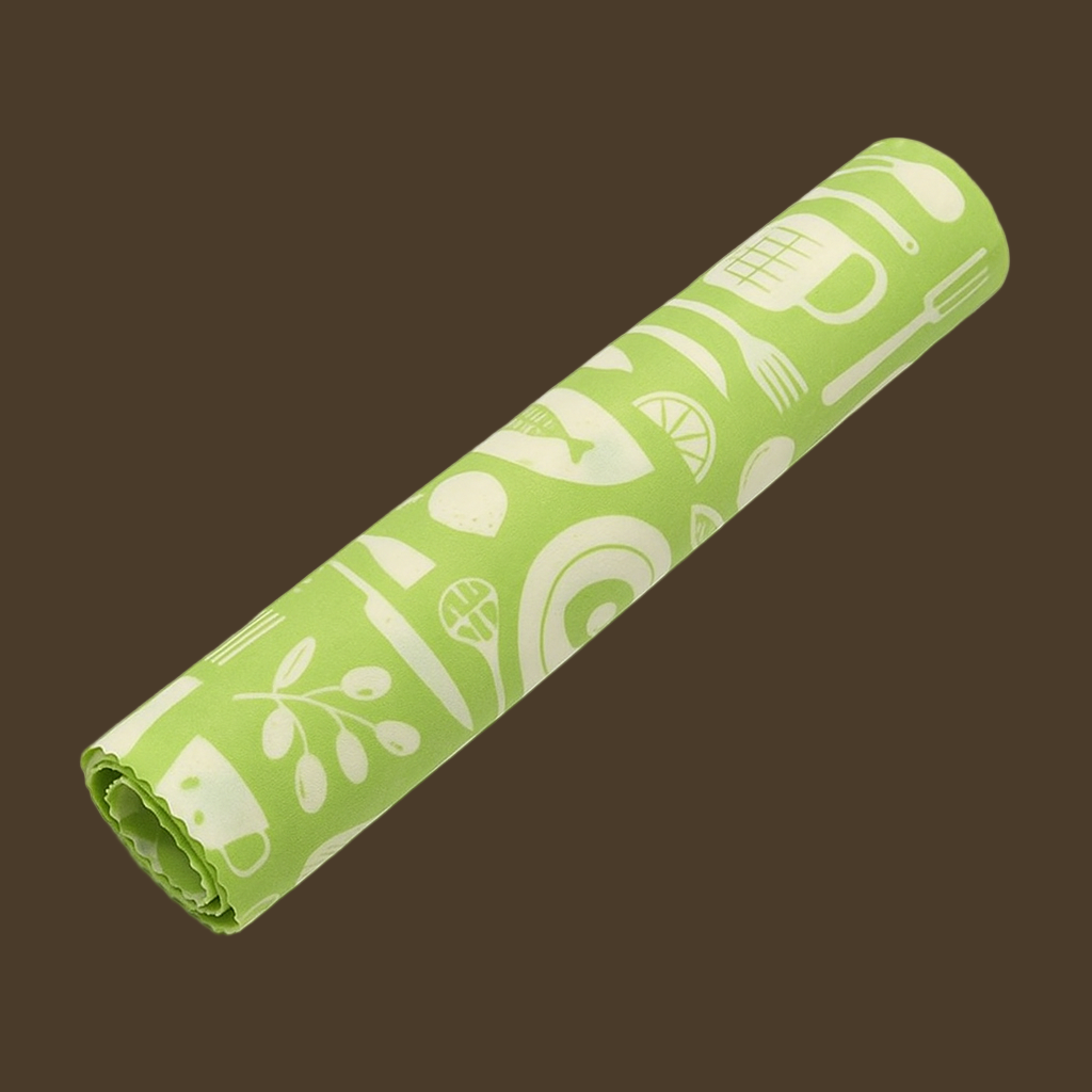Rolled-up green beeswax roll with white patterns