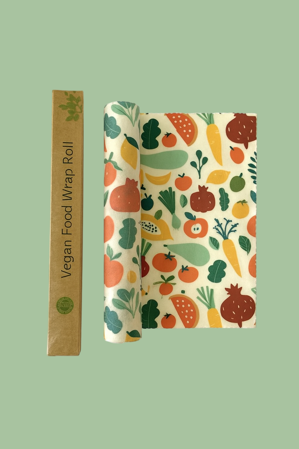 Roll of vegan food wrap with fruit and vegetable pattern on a white background